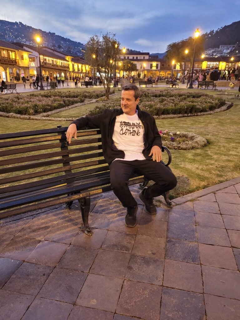 Soberminds founder on a bench, wearing the sober habits and discipline behind the brand