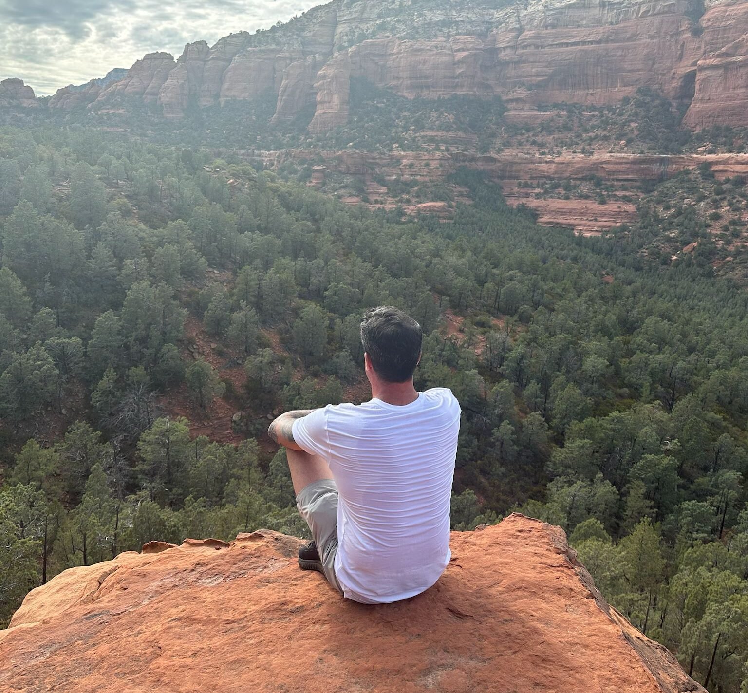 Man reflecting on grief and healing while learning to let go after addiction.