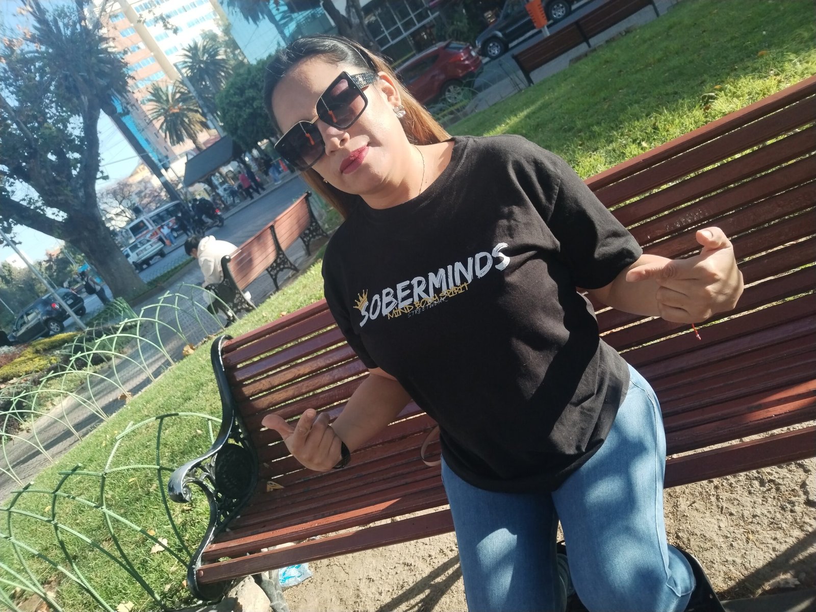 Woman wearing a Soberminds hoodie, the kind of sobriety anniversary gift that becomes part of daily life