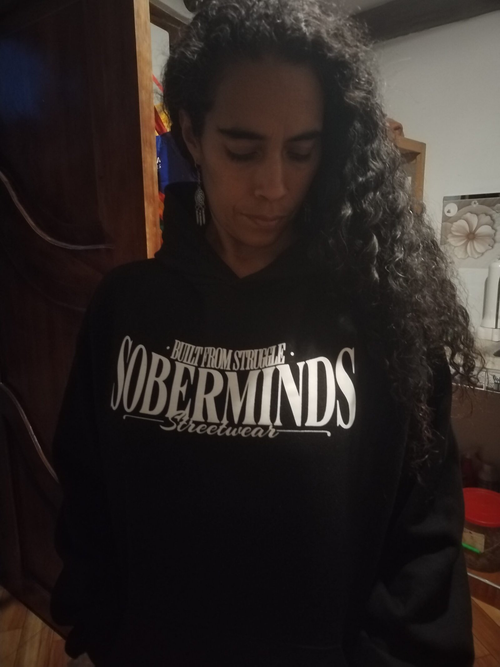 Woman wearing Soberminds apparel, living proof that sobriety anniversary gifts can become everyday staples